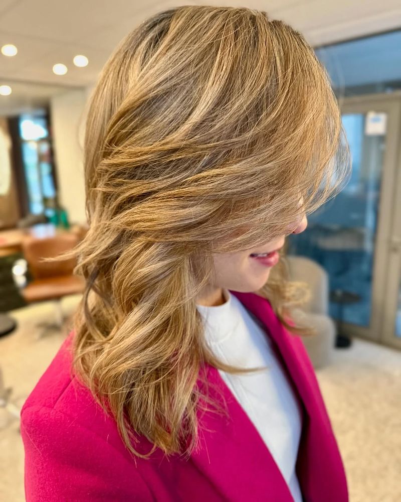 16. Honey Blonde Swooping Layers