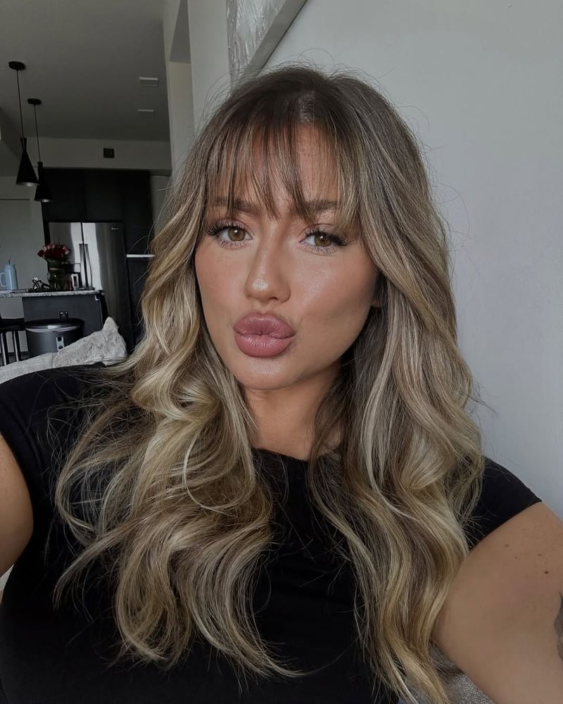 48. Honey Blonde Waves with Airy Fringe
