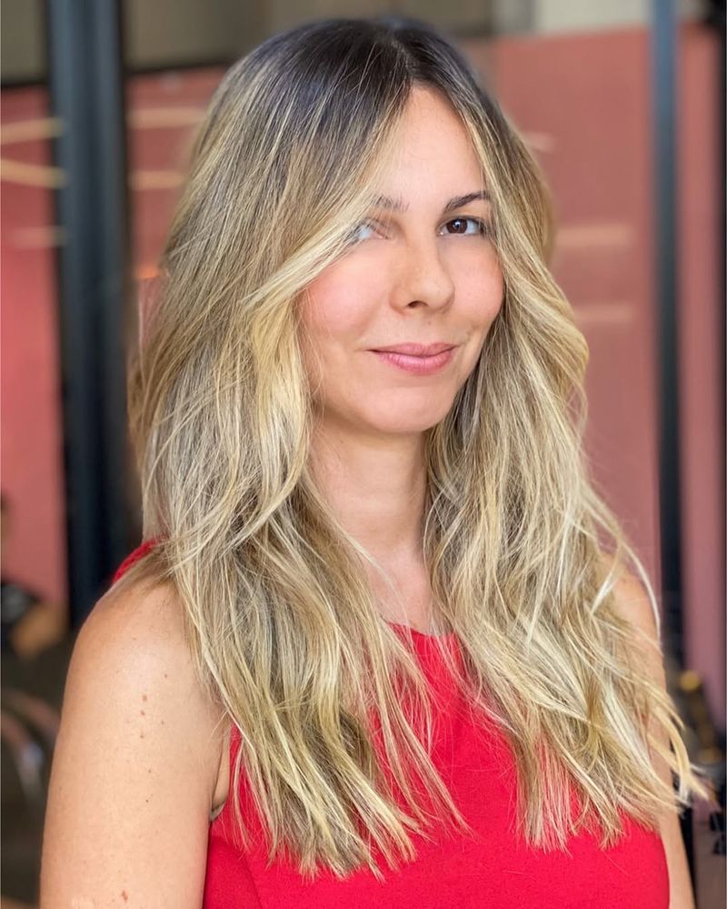 13. Honey Blonde Waves with Hidden Layers