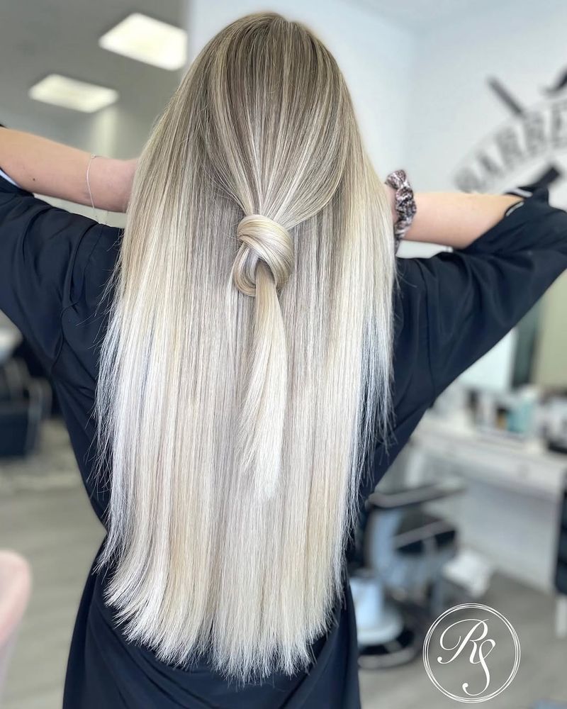 31. Icy Half-Up Knotted Blonde