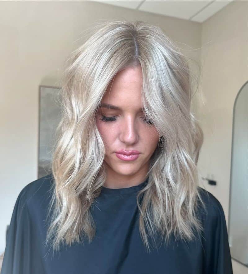 20. Icy Pearl Waves with Curtain Bangs