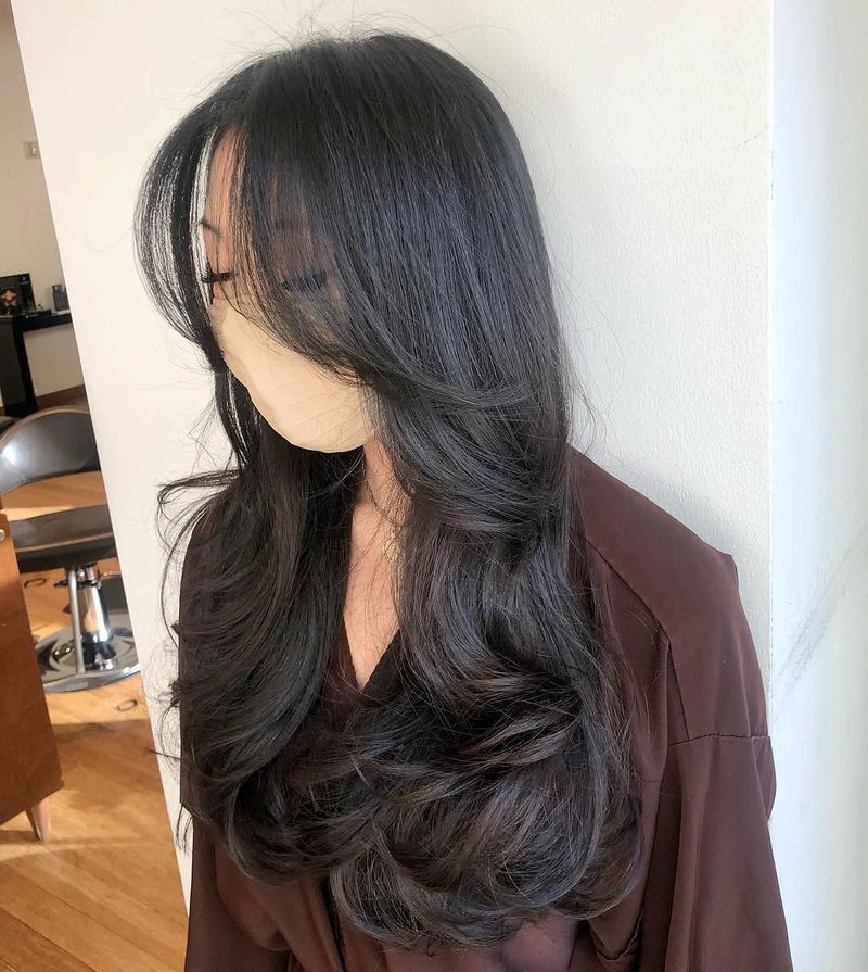 20. Jet Black Blowout Layers with Curved Fringe