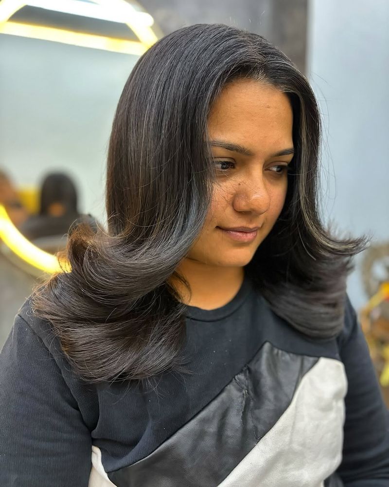 16. Jet Black Waterfall Layers with Curled Ends