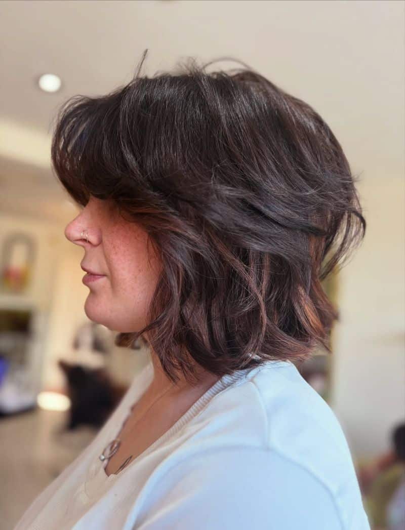 13. Layered Brunette Shag Bob with Soft Fringe