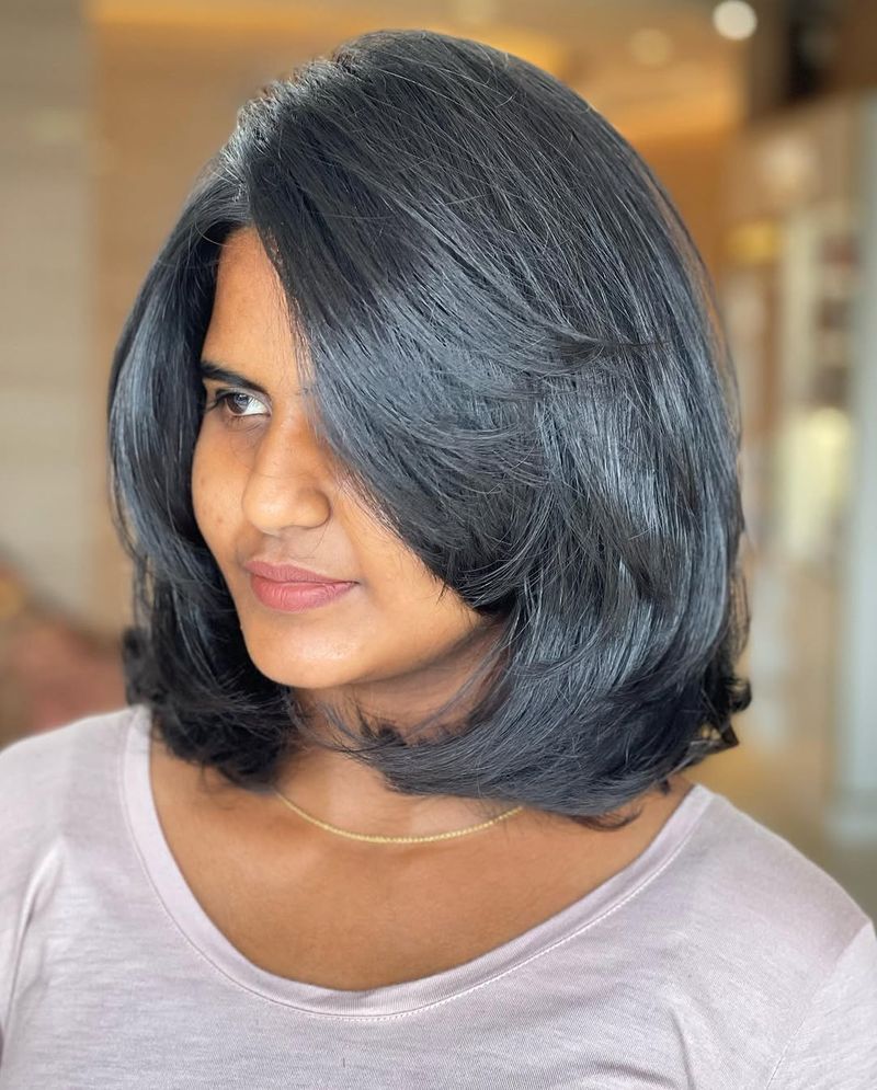 55. Layered Jet Black Lob with Side Part