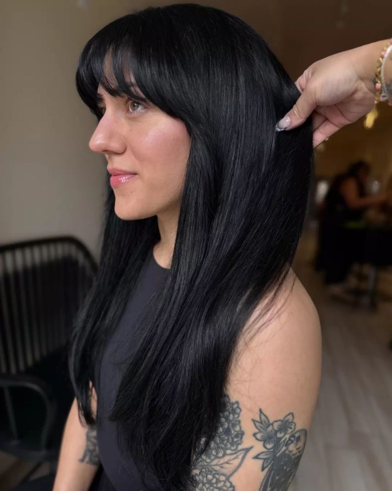 23. Long Jet Black Hair with Full Bangs