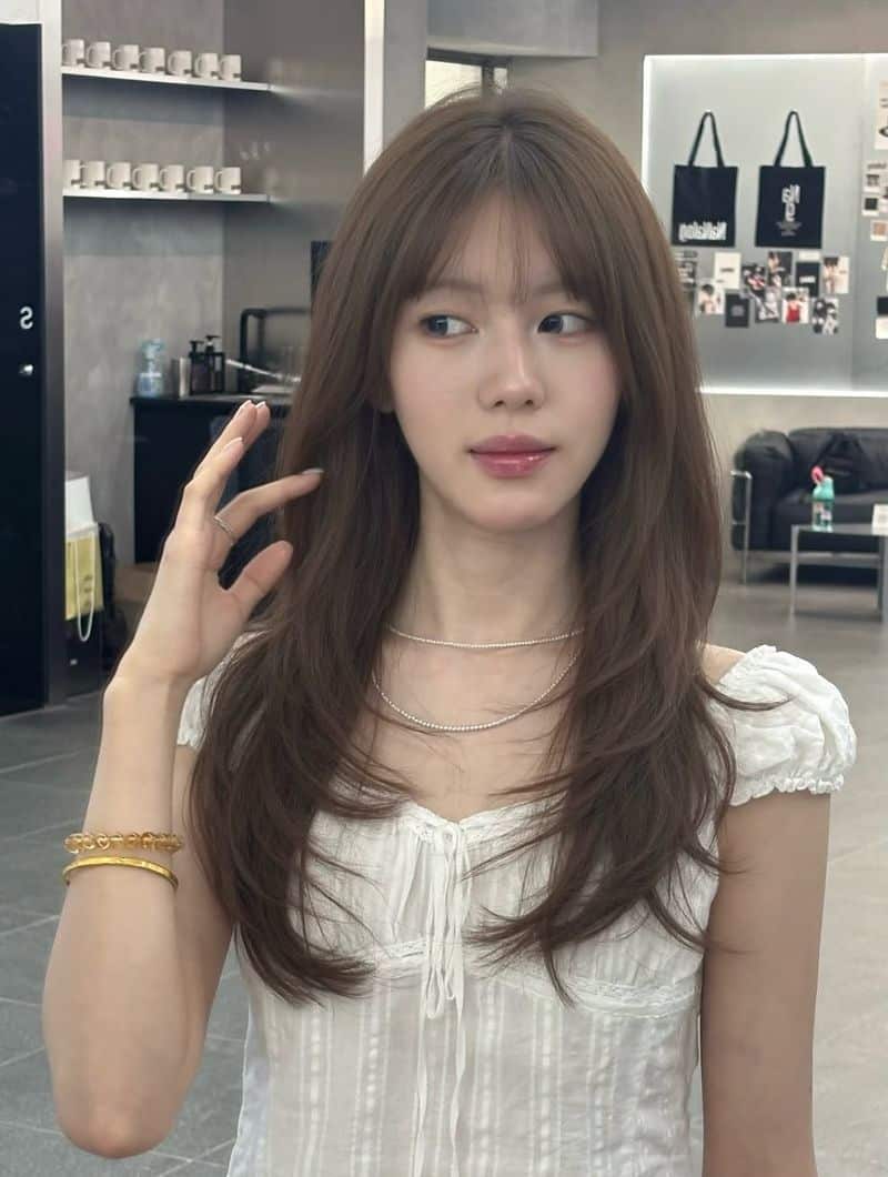 7. Long Layered Ash Brown with Wispy Bangs