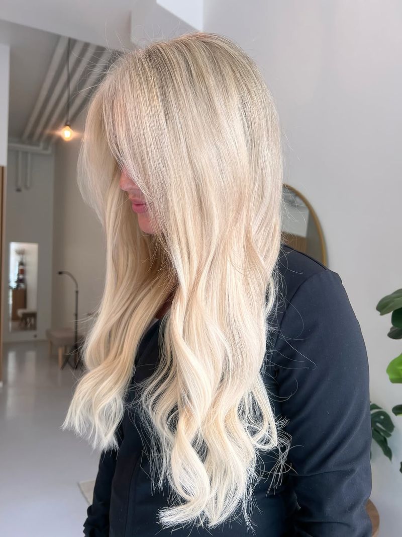 5. Long Layered Ice Blonde with Curtain Bangs