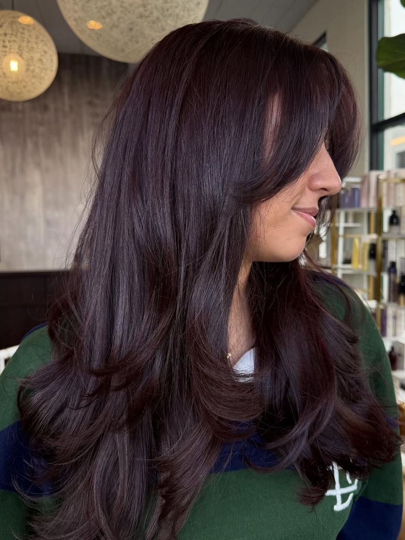 12. Long Layers with Curtain Bangs
