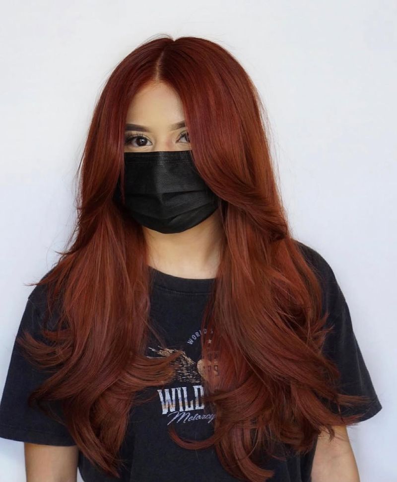 4. Long Layers with Curtain Bangs