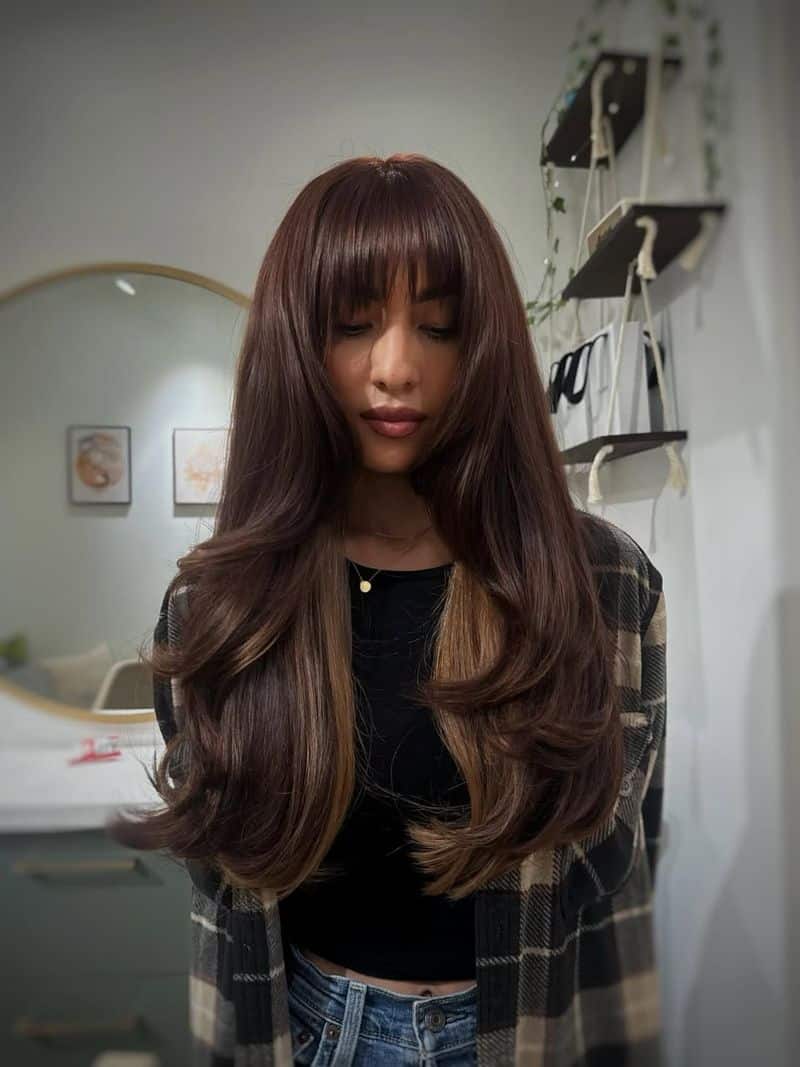 30. Long Layers with Peekaboo Blonde and Full Bangs