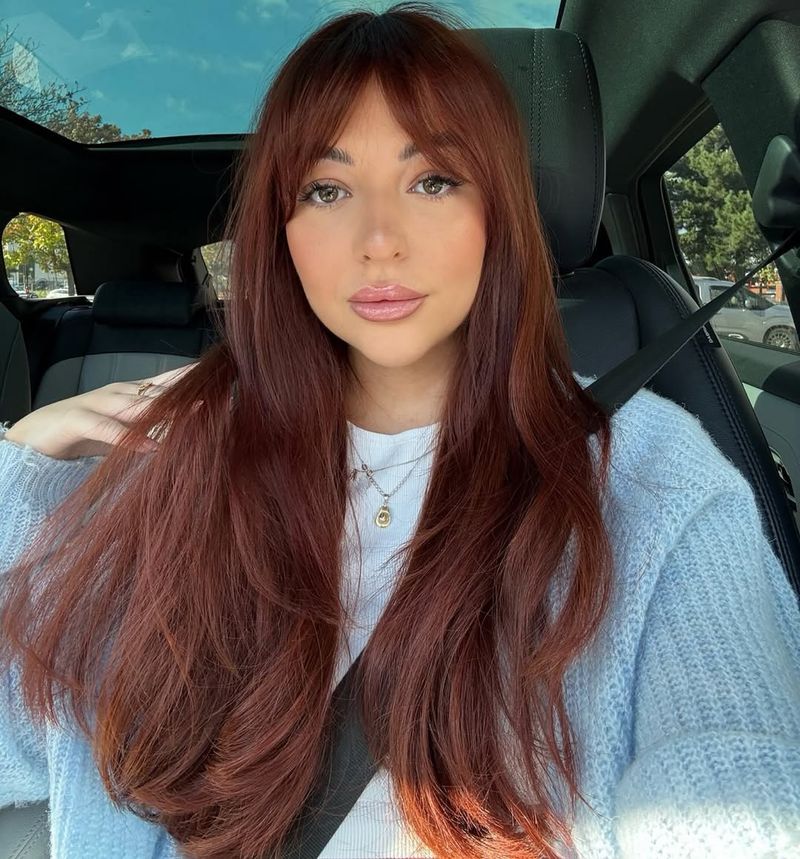 26. Long Layers with Wispy Bangs