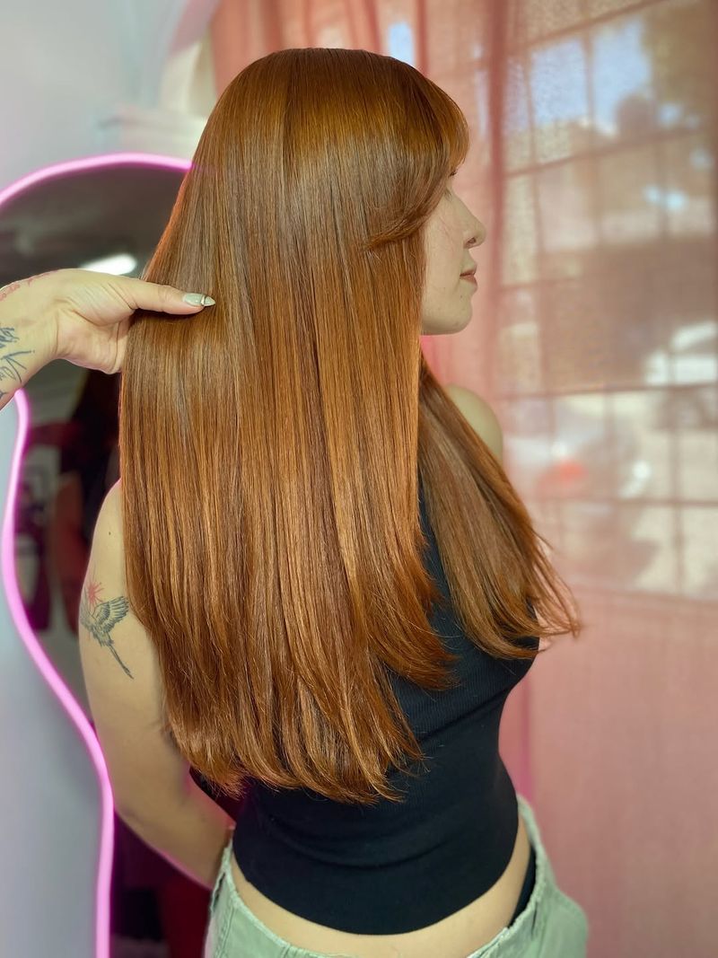 18. Long Silky Layers with Soft Bangs