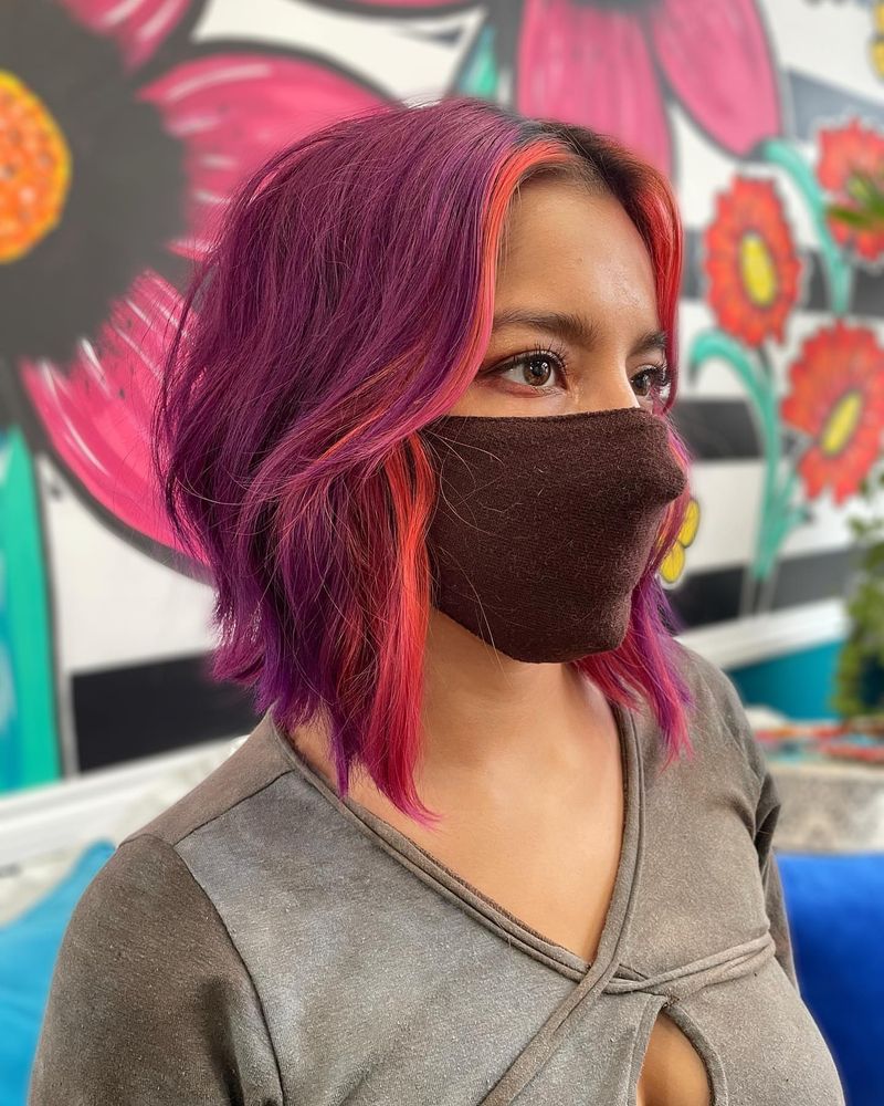 23. Magenta and Coral Neon Gradient Inverted Bob