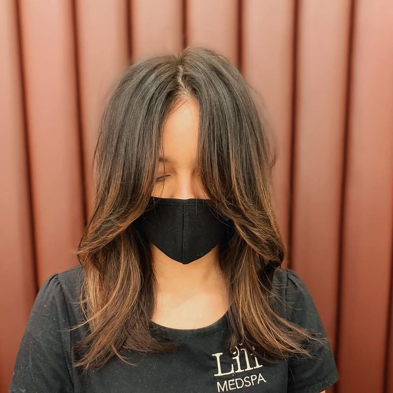 19. Medium Length With Sweeping Curtain Bangs