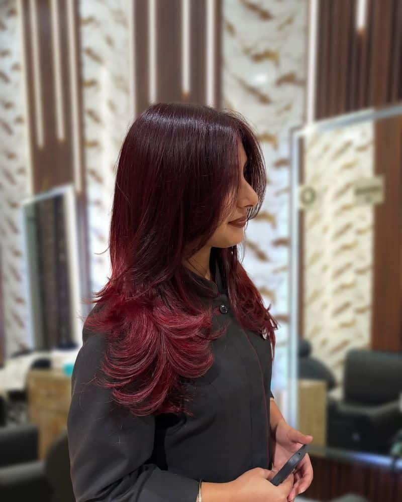 11. Merlot Layers with Curtain Bangs