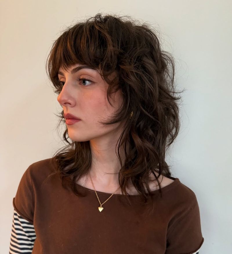 6. Messy Brunette Shag with Full Bangs