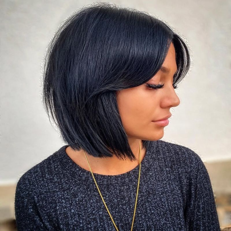 30. Midnight Blue Bob with Curtain Bangs