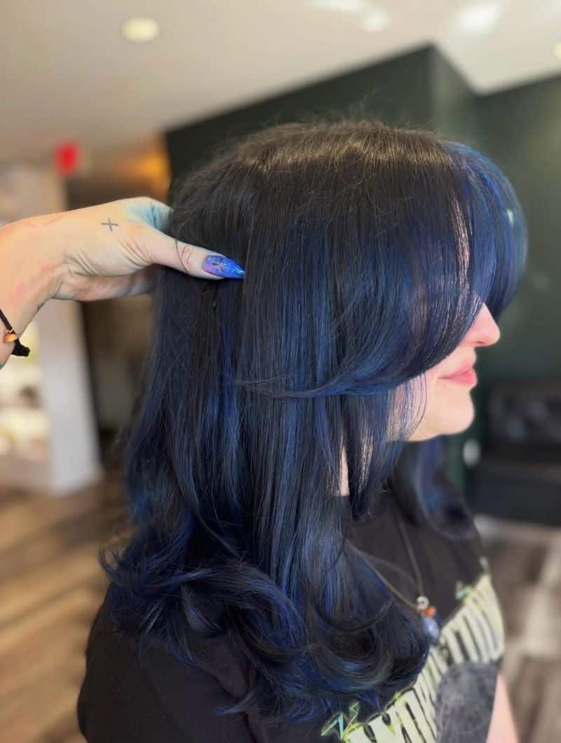 6. Midnight Blue Layers with Curtain Bangs