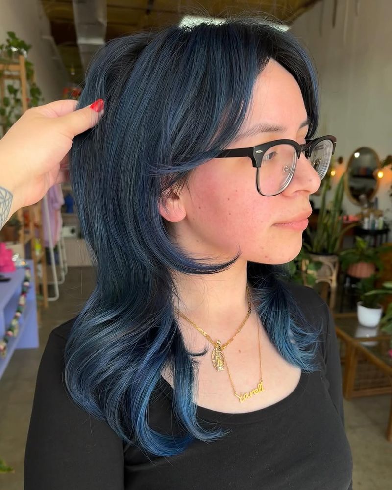 13. Midnight Blue Shag with Face-Framing Layers