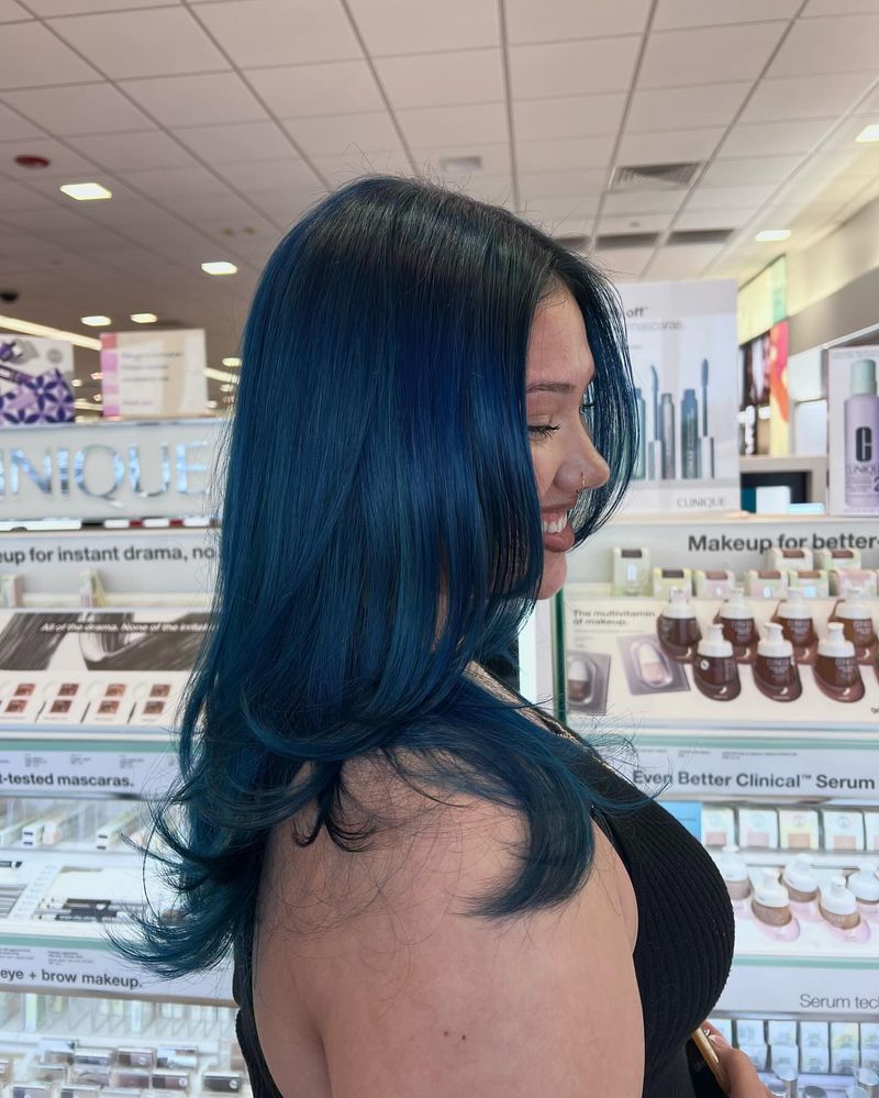 24. Midnight Blue Waves with Face-Framing Layers