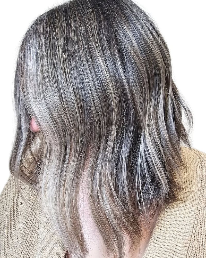 50. Multi-Tonal Silver Highlights on Dark Brown Hair