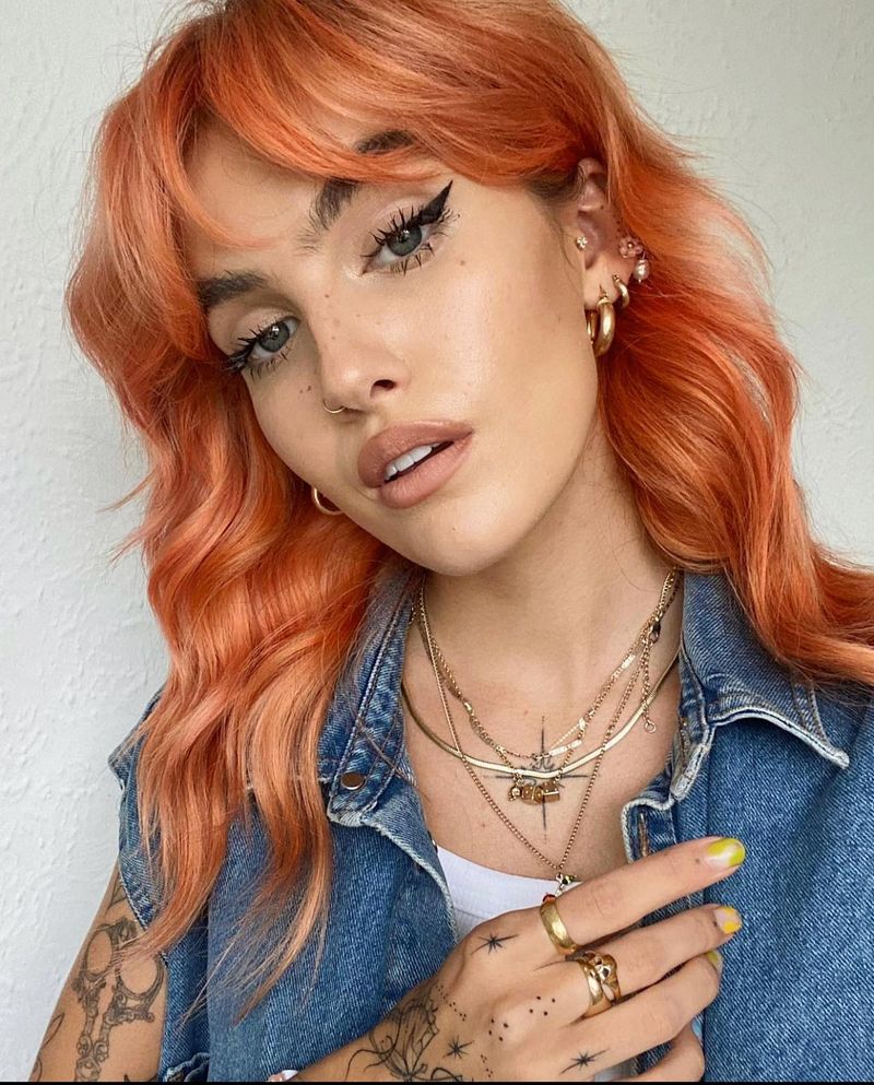 35. Neon Peach Shag with Curtain Bangs