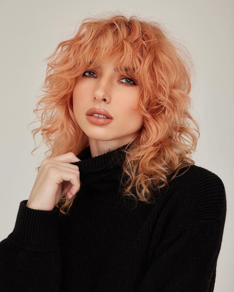 38. Peachy Curly Shag with Bangs