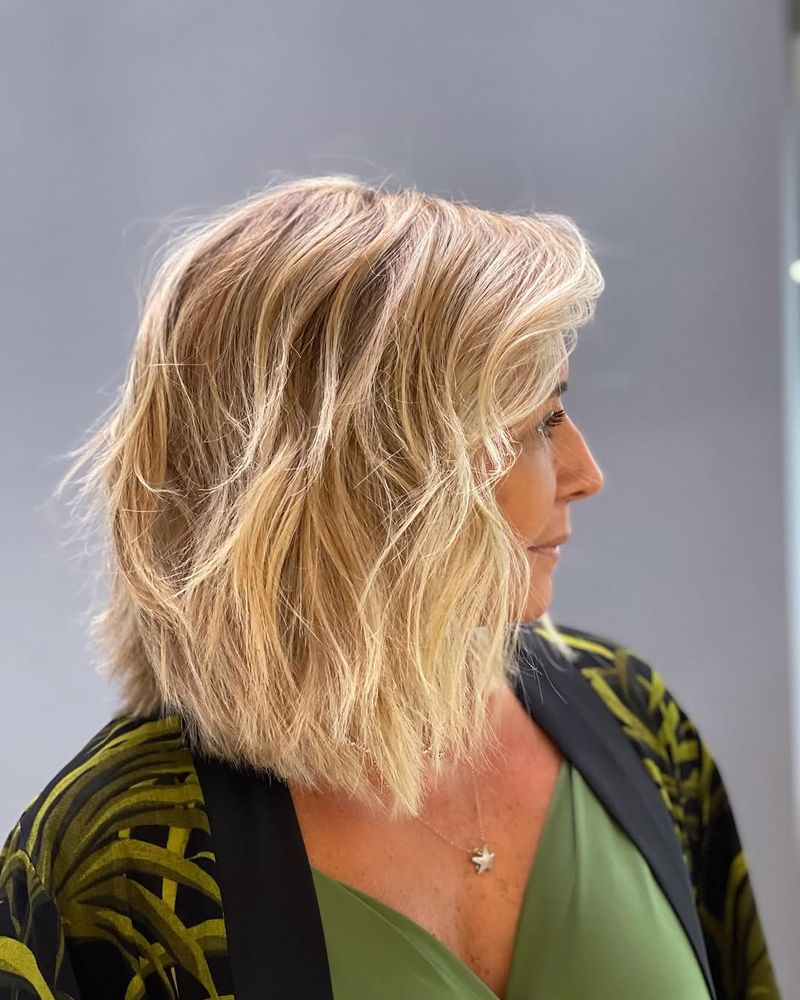 28. Piecey Blonde Lob with Hidden Depth