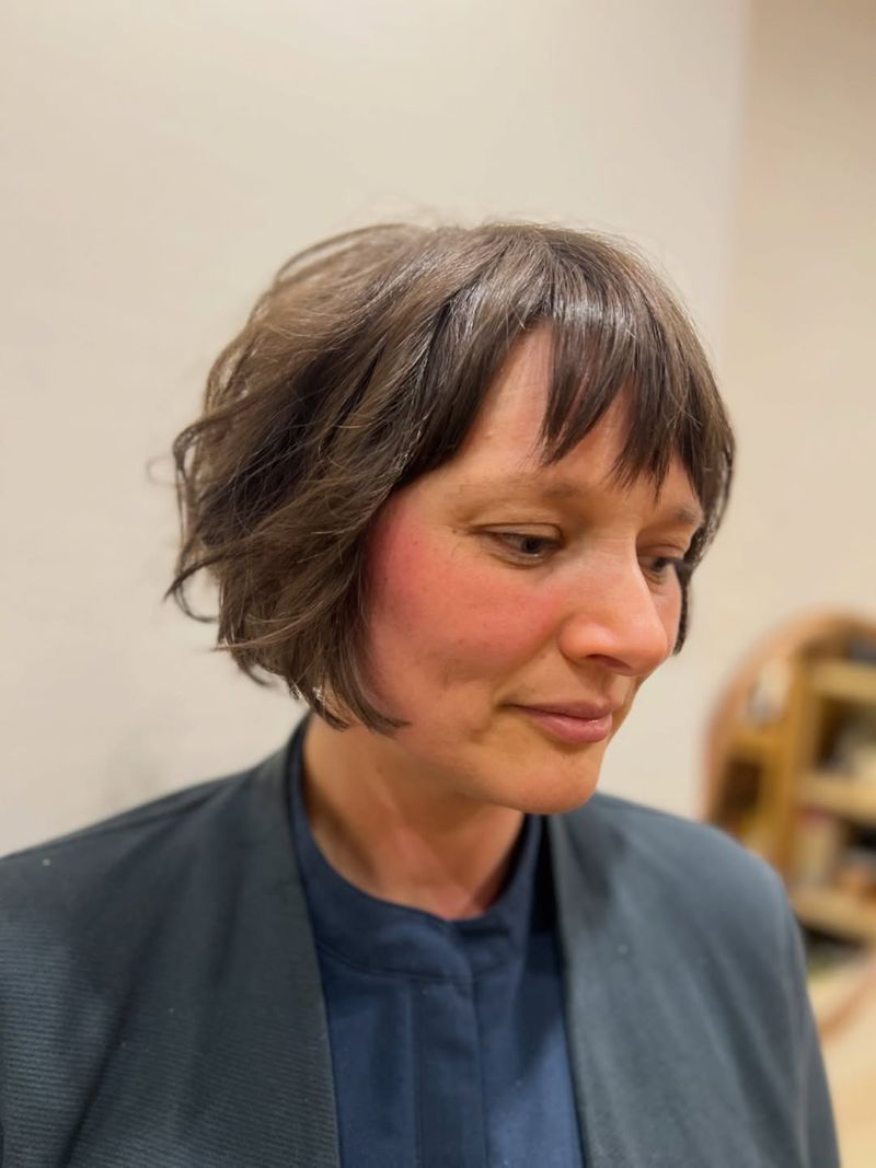 20. Piecey Brunette Bob with Soft Bangs
