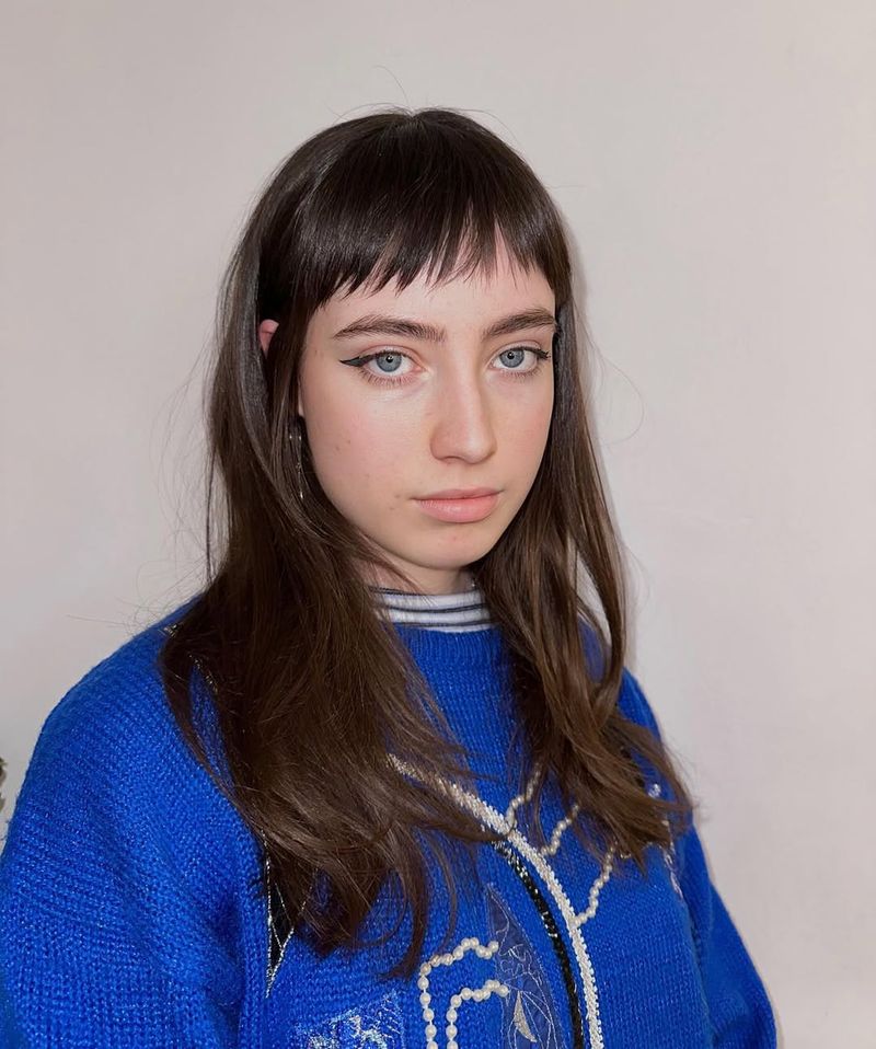 18. Piecey Brunette Micro Bangs