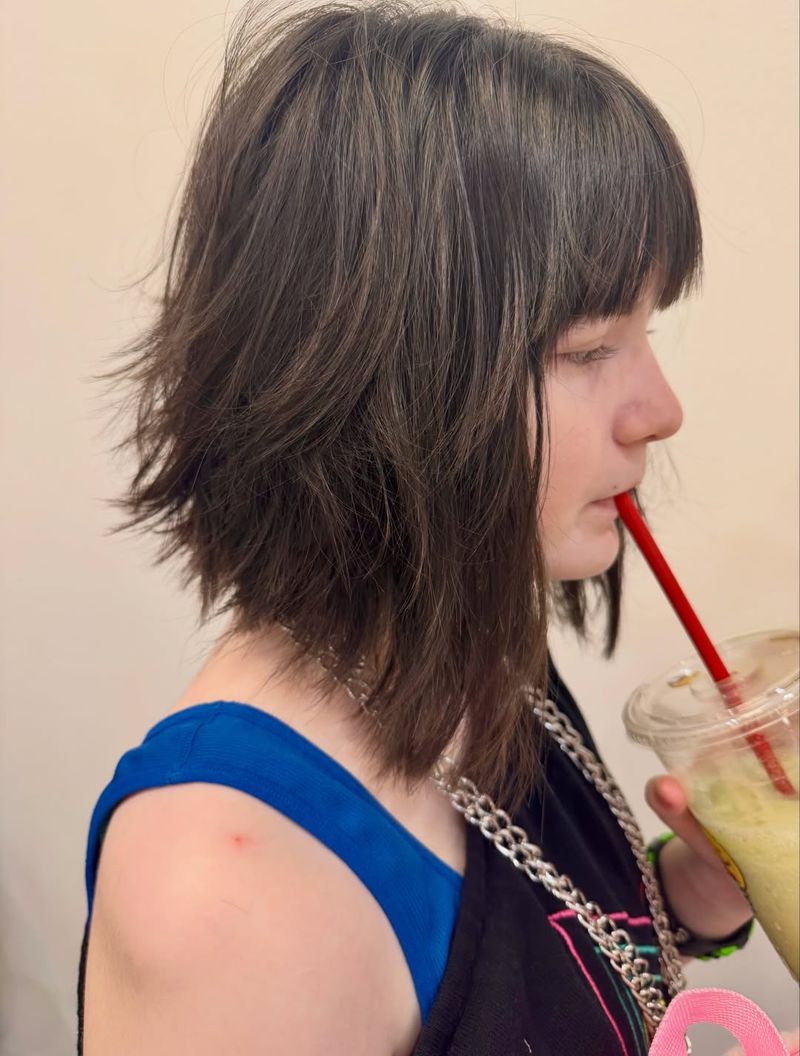 22. Piecey Brunette Shag with Full Bangs