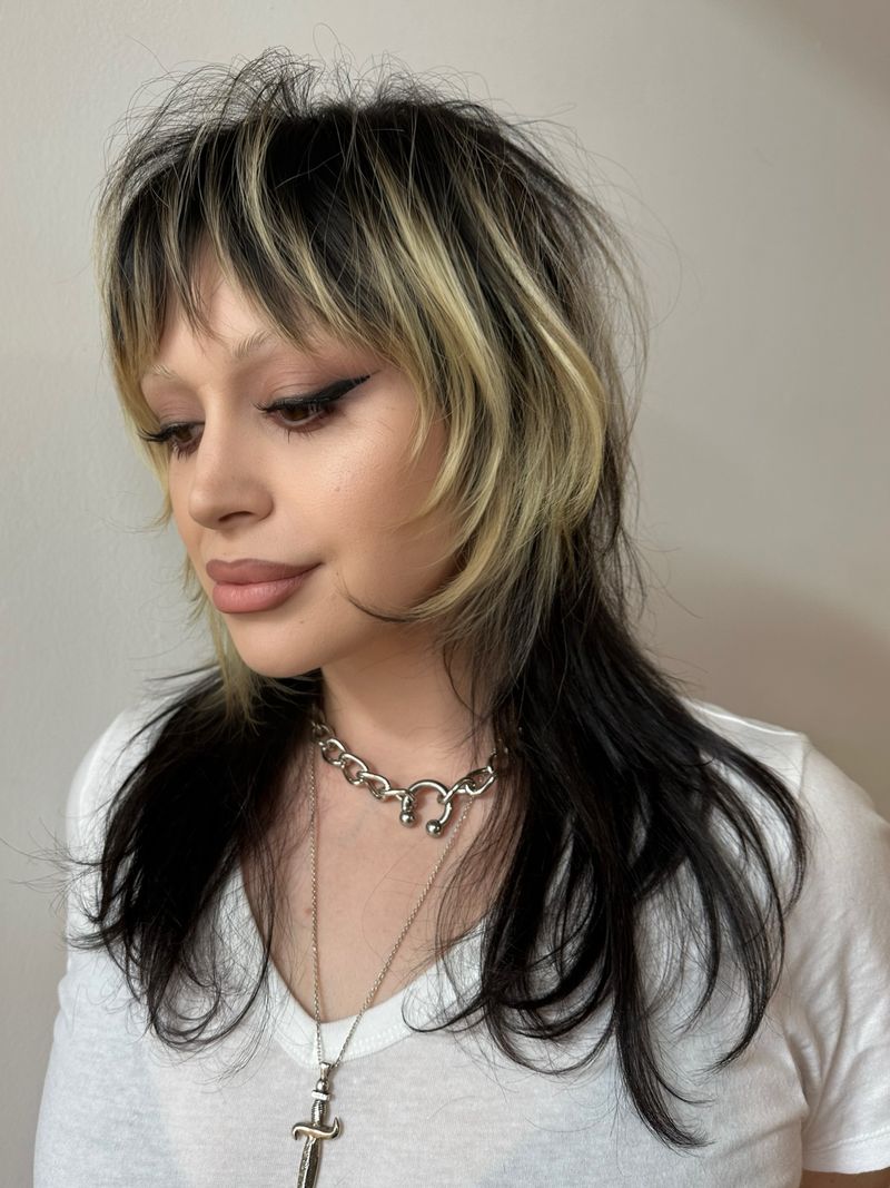 54. Platinum Blonde Highlighted Shag with Wispy Fringe