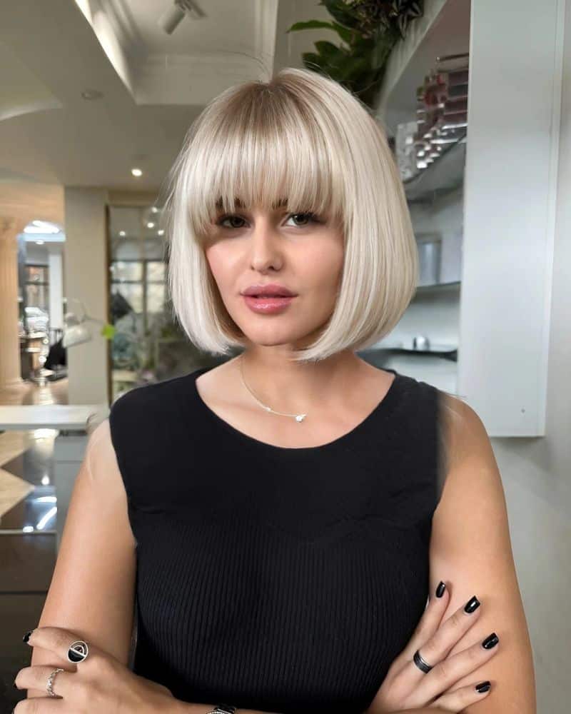29. Platinum Blonde Rounded Bob with Heavy Fringe