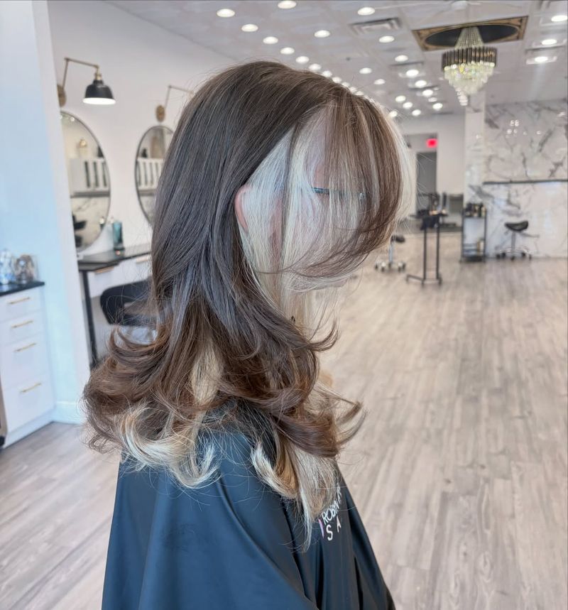 28. Platinum Face-Framing Peekaboo Layers