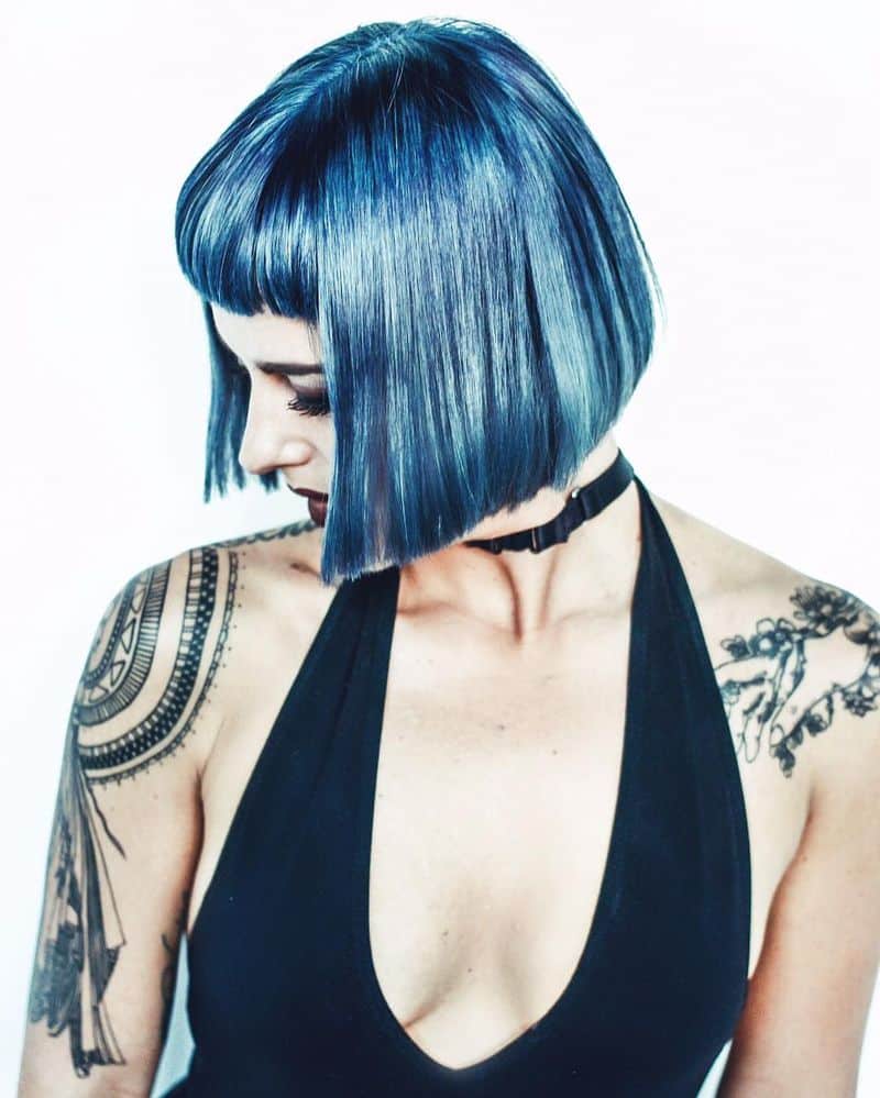 36. Razor-Sharp Navy Bob with Micro Bangs