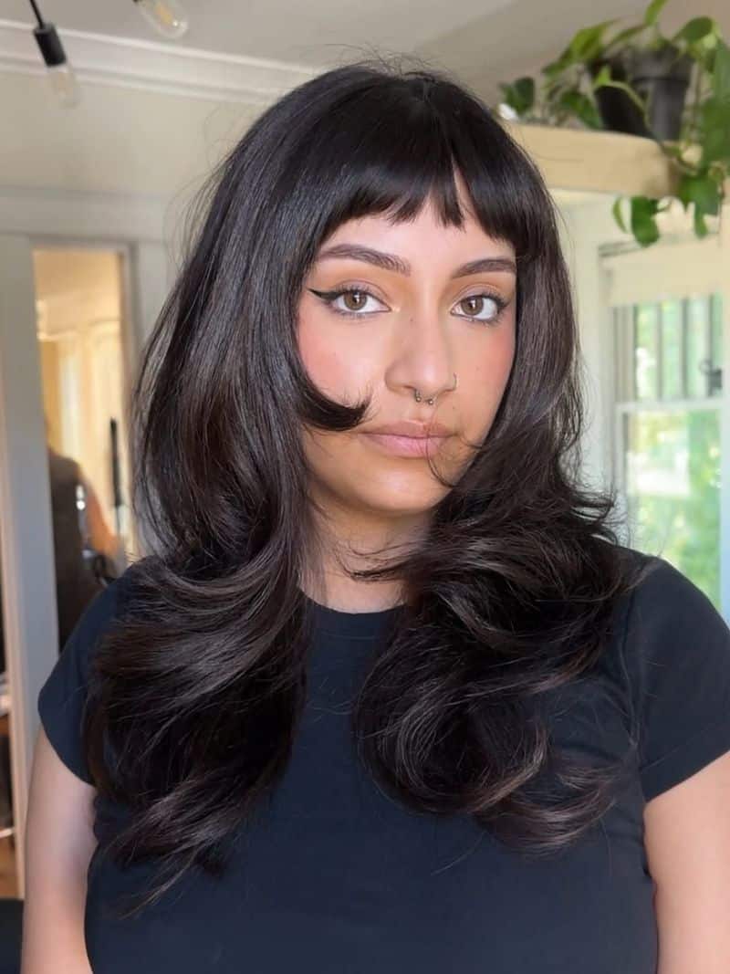 7. Retro Blowout with Piecey Micro Bangs