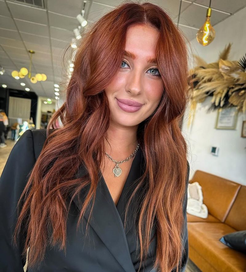 39. Rich Auburn Waves with Curtain Bangs