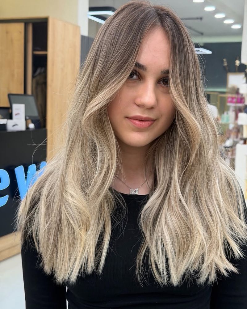 23. Root-Smudged Pearl Blonde Balayage