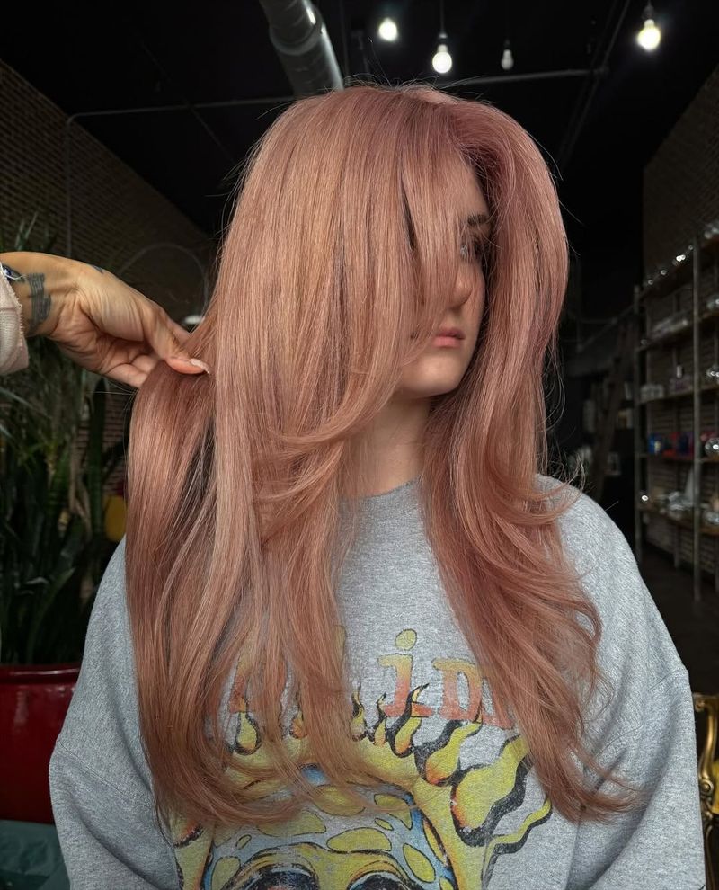 57. Rose Gold Layers with Curtain Bangs