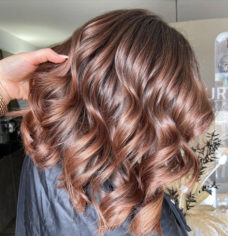22. Rosewood Curls with Dark Roots