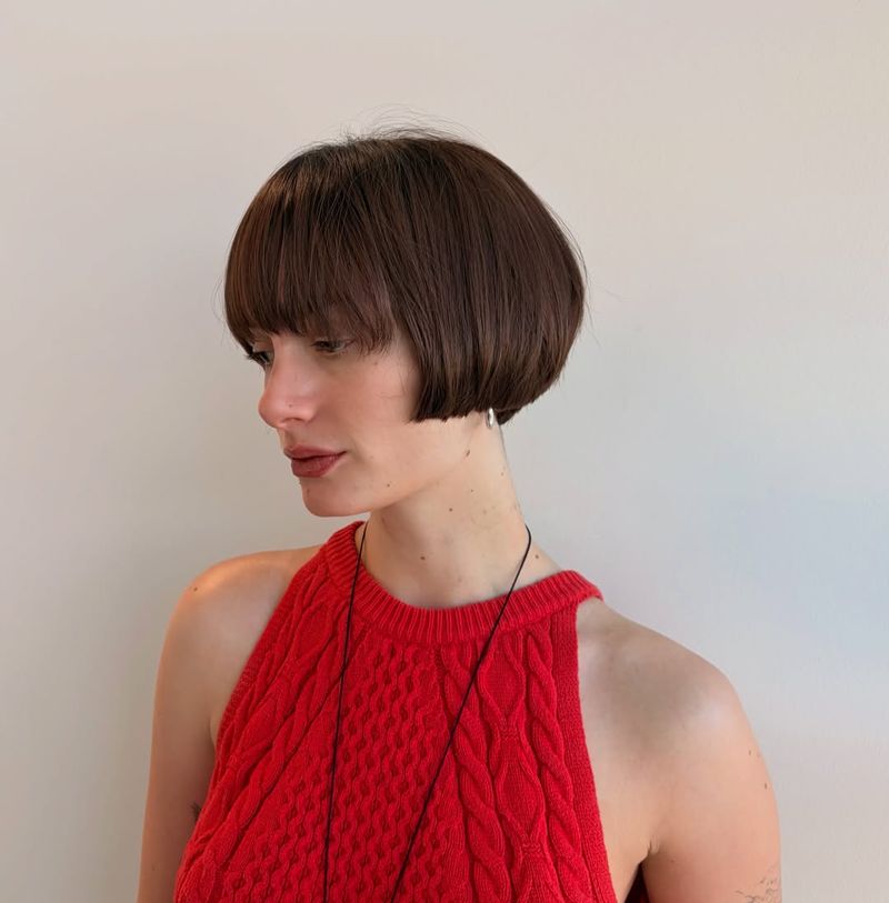 30. Rounded Brunette Bob with Micro Bangs