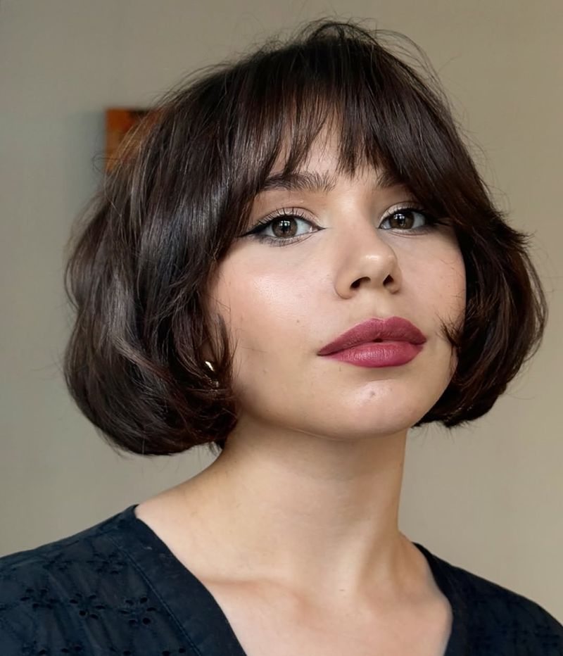 26. Rounded Espresso Bob with Wispy Bangs