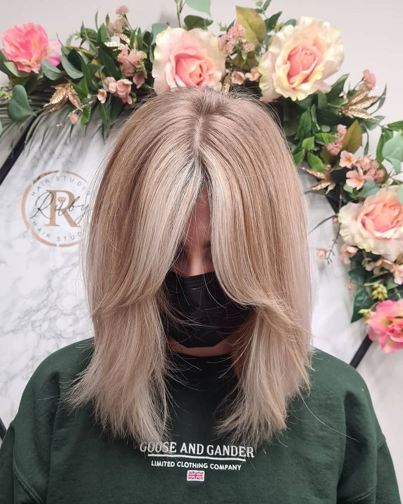 22. Sandy Blonde Curtain Fringe Lob