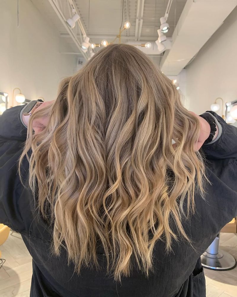 6. Sandy Blonde Waves with Hidden Depth