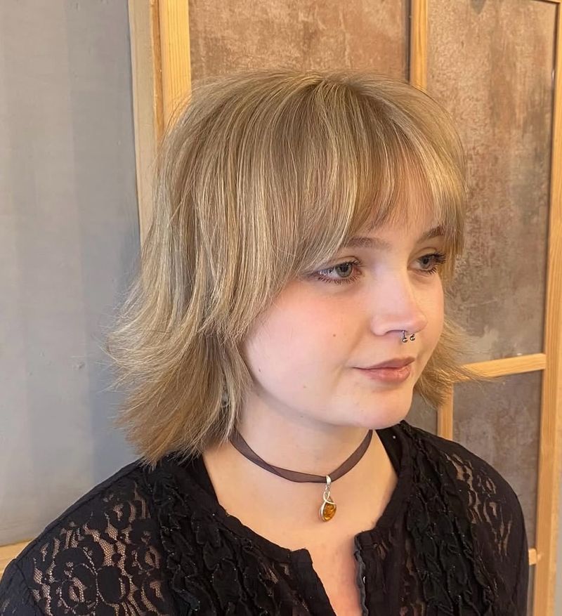 2. Shaggy Blonde Bob with Wispy Bangs