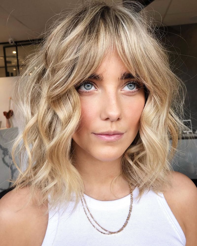 3. Shaggy Blonde Lob with Curtain Bangs