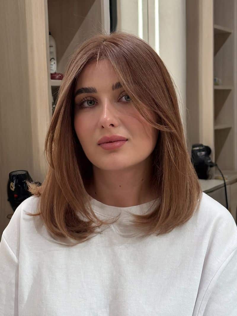 38. Shoulder-Length Lob with Soft Curtain Bangs