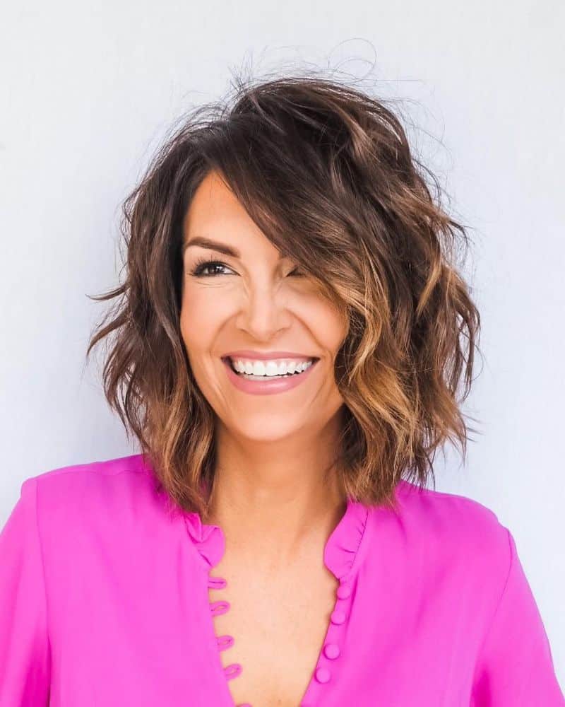 38. Side-Swept Layered Bob with Honey Highlights