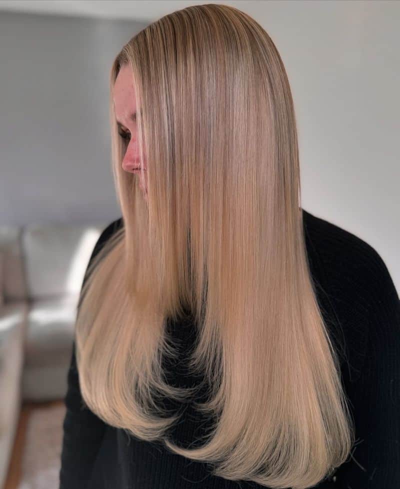 32. Silky Blonde Feathered Layers